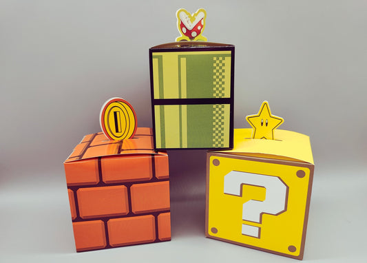 Set of 12 Super Mario Bros Favor Boxes - Brick, Question Mark, Sewer Pipe designs with Coins, Stars, Venus Flytrap. 4 of each box in a set.