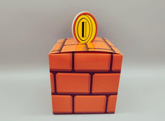 Set of 12 Super Mario Bros Favor Boxes - Brick, Question Mark, Sewer Pipe designs with Coins, Stars, Venus Flytrap. 4 of each box in a set.