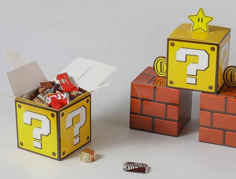 Set of 12 Super Mario Bros Favor Boxes - Brick, Question Mark, Sewer Pipe designs with Coins, Stars, Venus Flytrap. 4 of each box in a set.