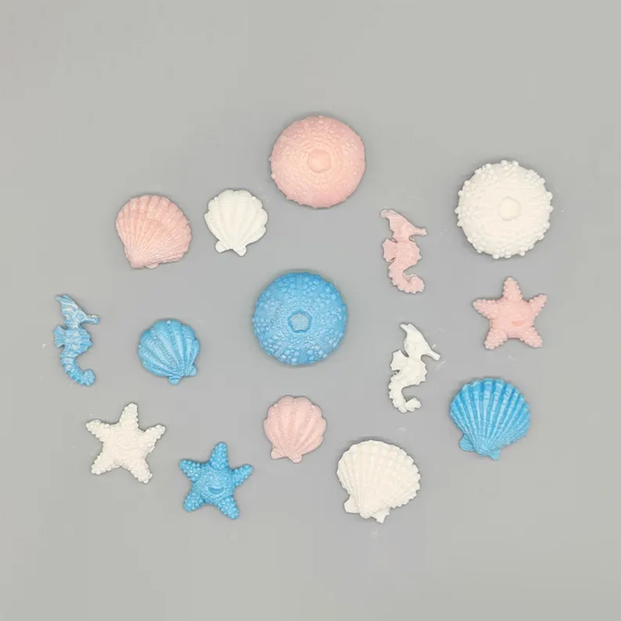 Sweet seascapes! Edible Fondant Underwater Sea Life: Seashells, Urchins, Starfish & Seahorses - 15 pieces in blue, pink, white with shimmer.