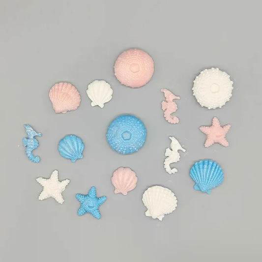 Sweet seascapes! Edible Fondant Underwater Sea Life: Seashells, Urchins, Starfish & Seahorses - 15 pieces in blue, pink, white with shimmer.