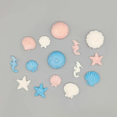 Sweet seascapes! Edible Fondant Underwater Sea Life: Seashells, Urchins, Starfish & Seahorses - 15 pieces in blue, pink, white with shimmer.
